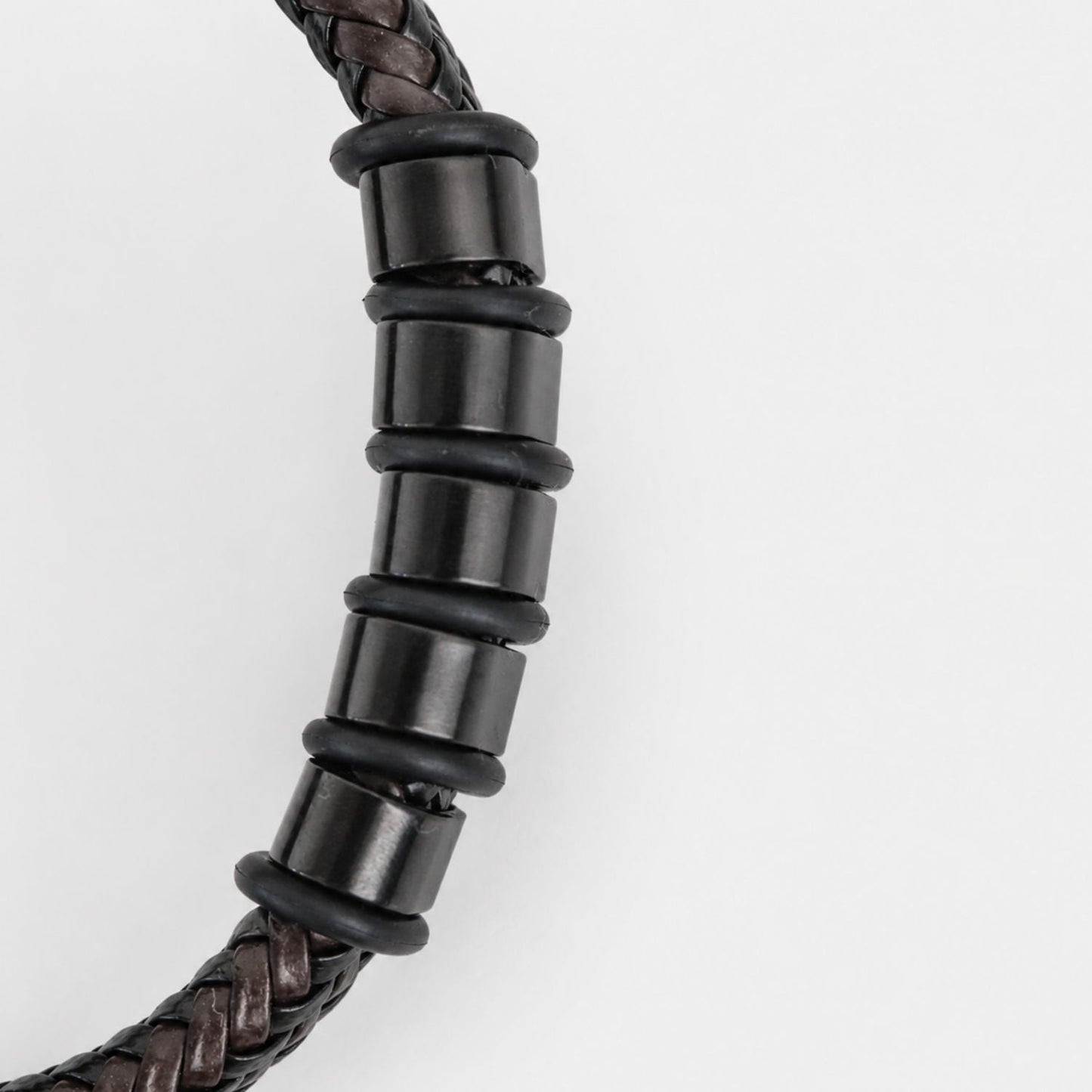 Close-up of engraved beads on bracelet